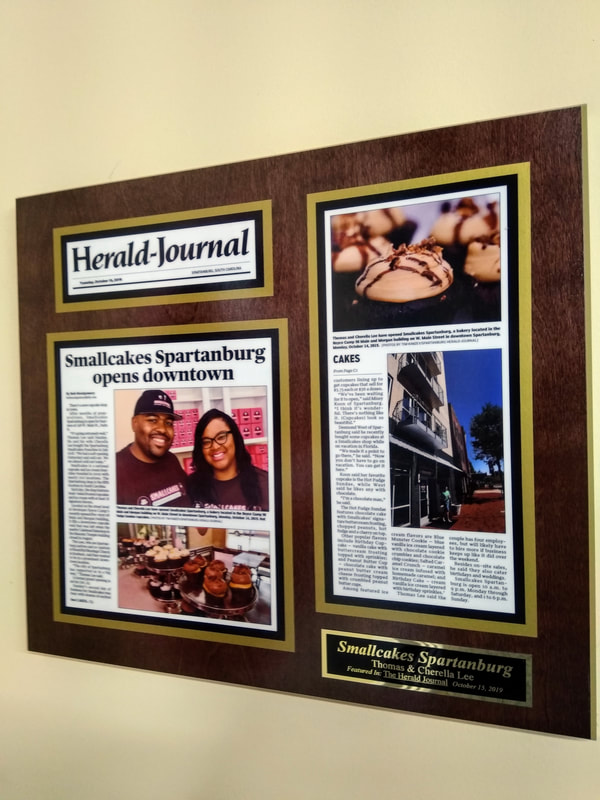 Plaque on wall of Herald-Journal story about SMALLCAKES.